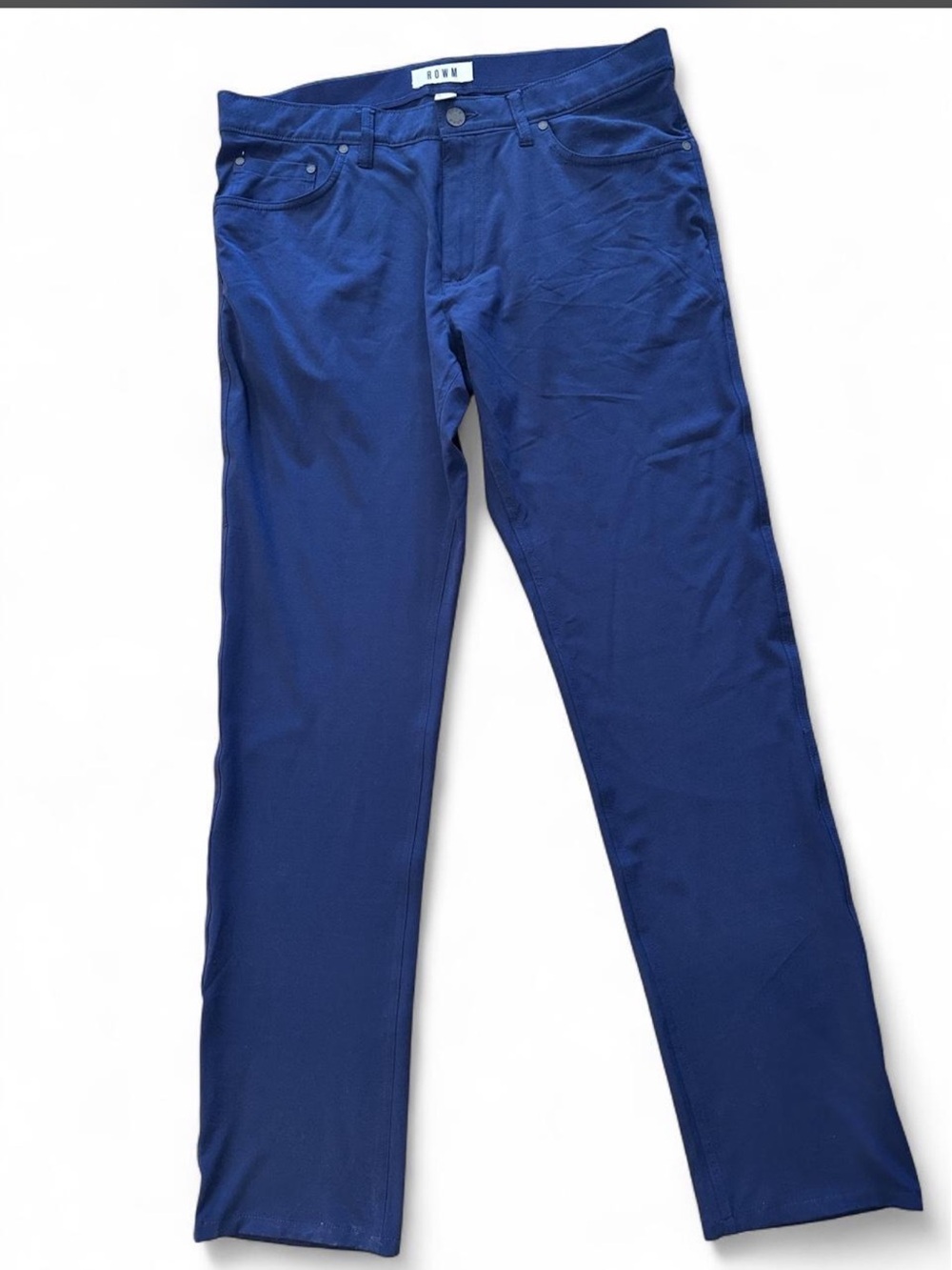 Clean, versatile ROWM navy performance pants in men’s 34x34